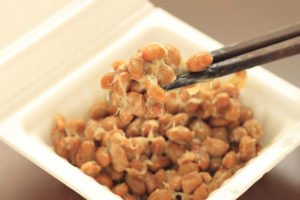 a container of natto (fermented soy beans}
