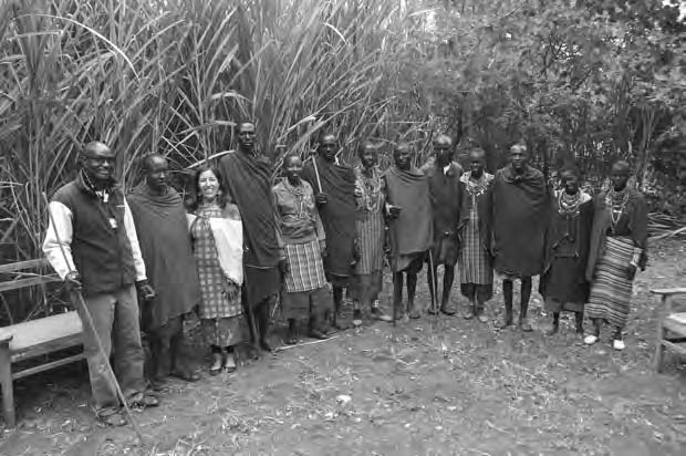 Dickson Ole Gisa (left) with the Maasi youth group and Hilda Labrada Gore (third from left).