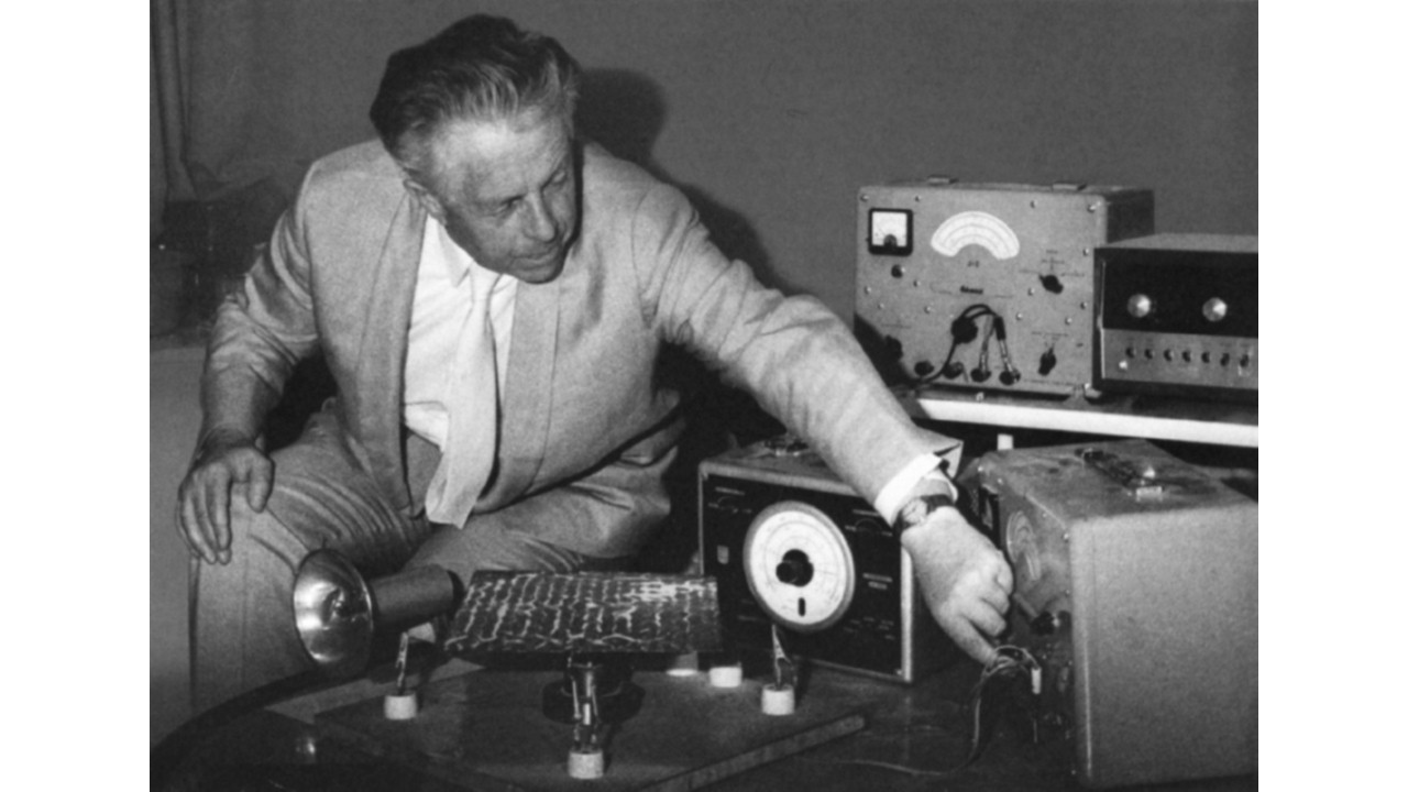 black and white photo of Hans Jenny, MD, making sound visible with his tonoscope