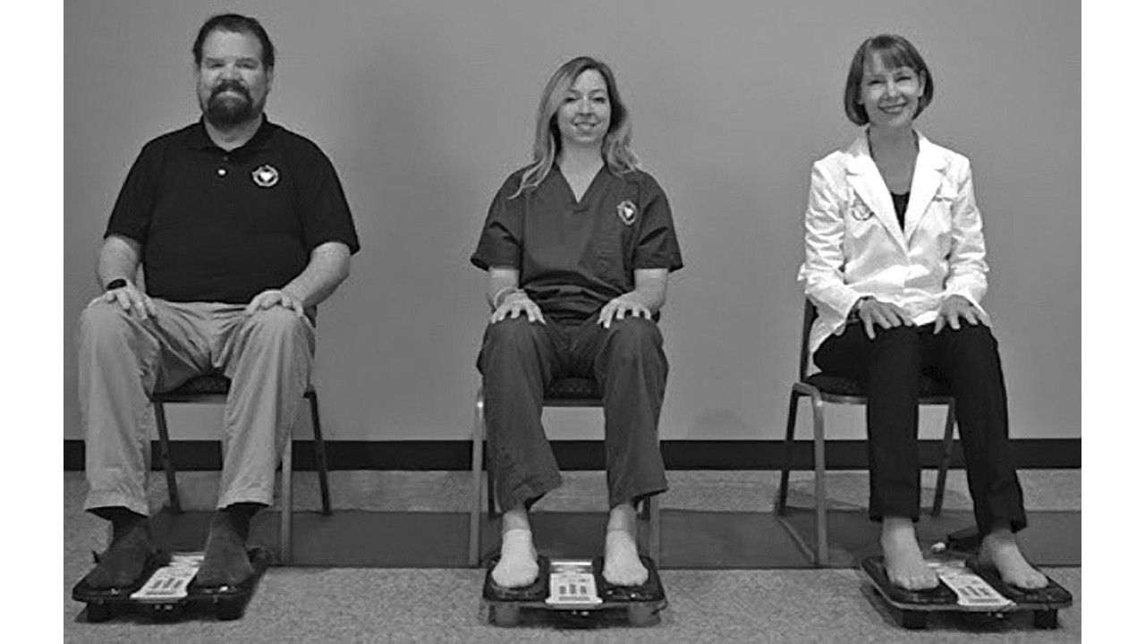 three participants using the AMI 750—healing sound frequencies through the soles of the feet