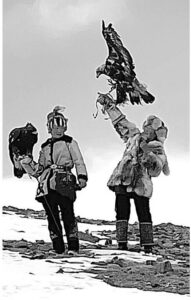 Two teenage Mongolian eagle hunters